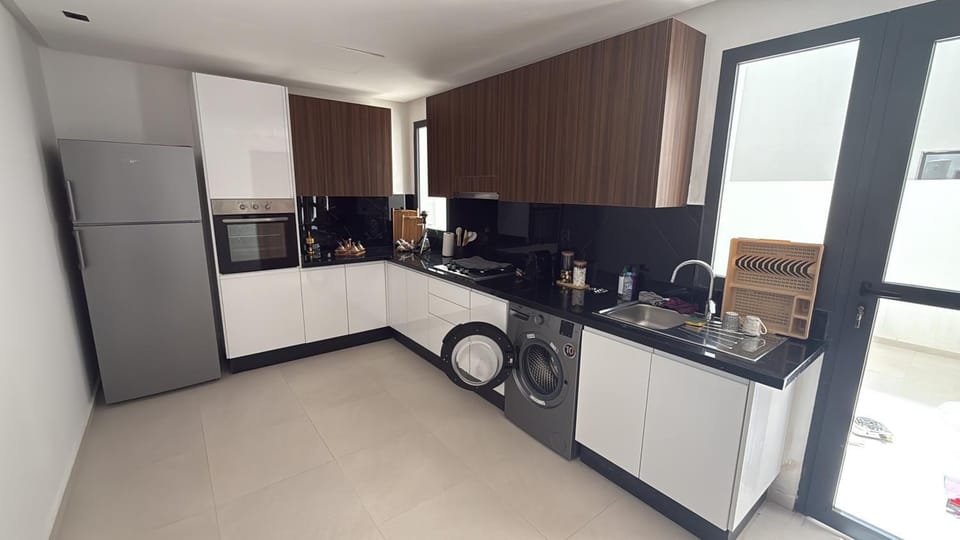 Kitchen or kitchenette, dishwasher, oven, stove