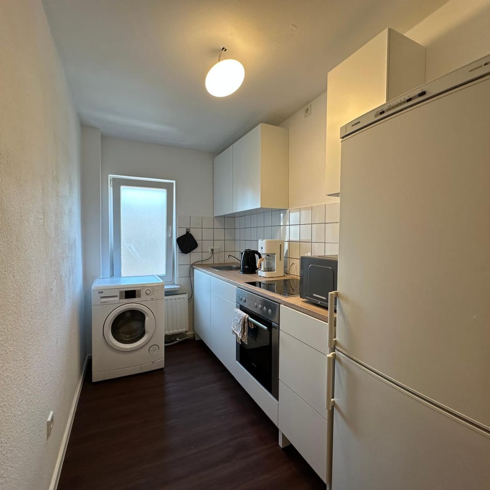 Kitchen or kitchenette, stove, washing machine