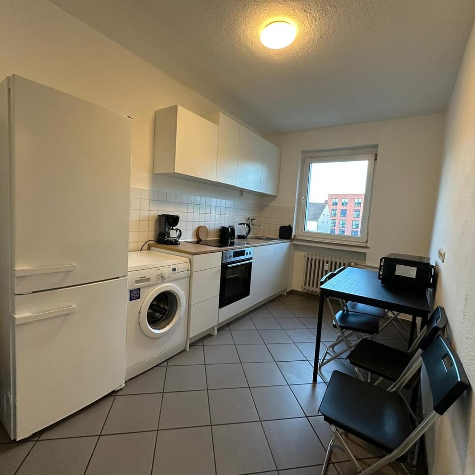 Kitchen or kitchenette, Dining area, stove, washing machine, dryer