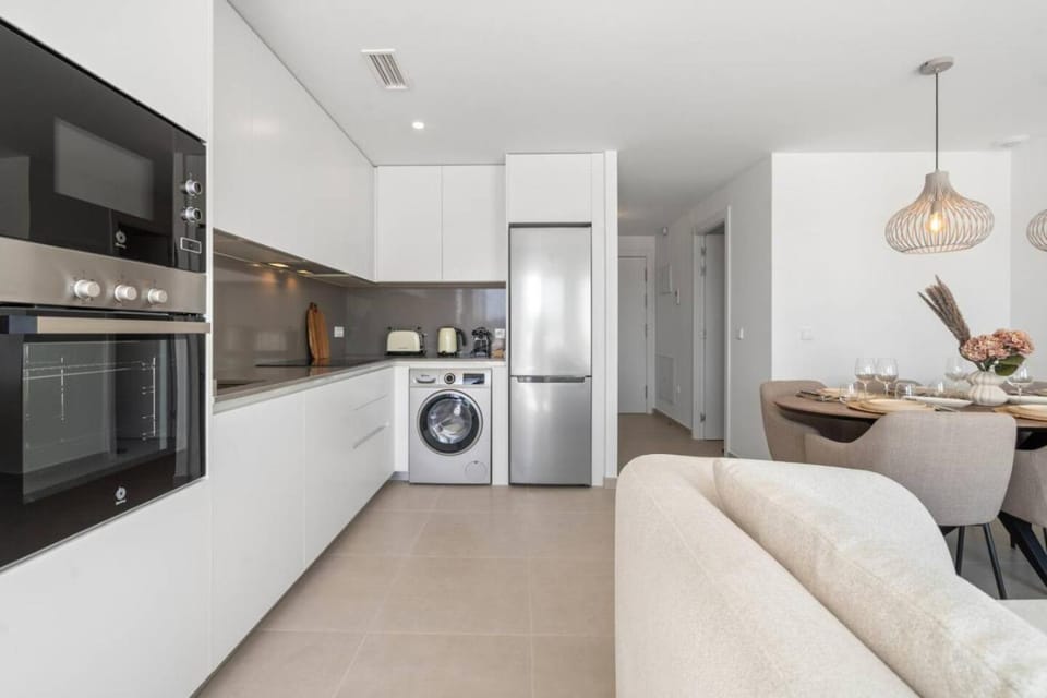 Kitchen or kitchenette, dishwasher, oven, toaster, washing machine