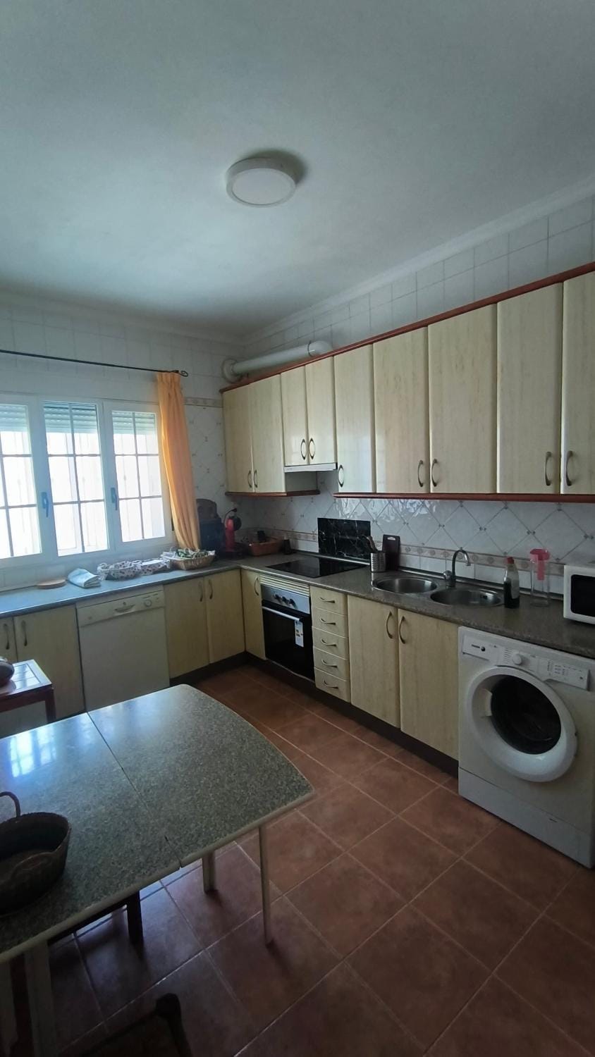 Kitchen or kitchenette, dishwasher, stove, toaster, washing machine