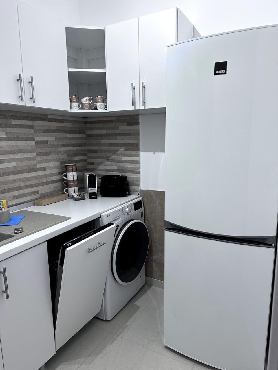 Kitchen or kitchenette, dishwasher, washing machine, dryer