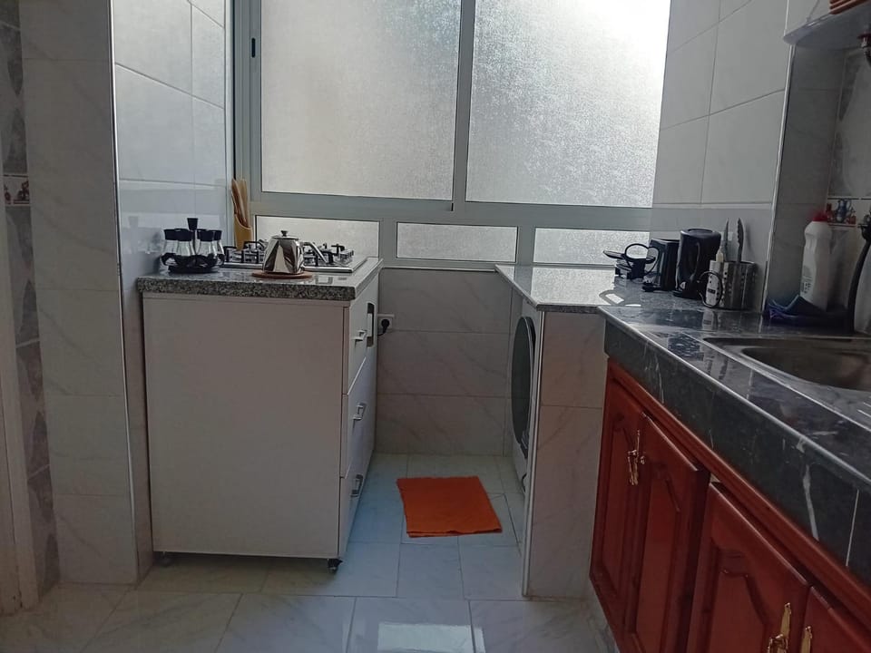 Kitchen or kitchenette, dishwasher, oven, stove