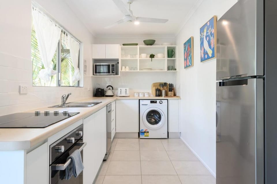 Kitchen or kitchenette, dishwasher, oven, stove, toaster, washing machine