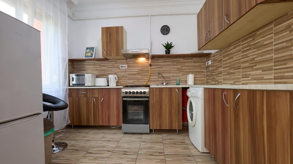 Kitchen or kitchenette, oven, stove, toaster, washing machine