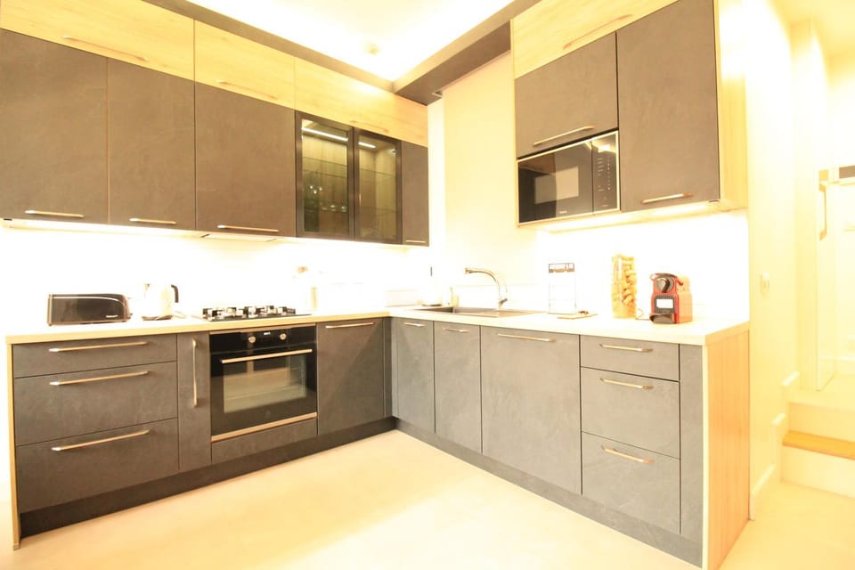 Kitchen or kitchenette, dishwasher, oven, stove, toaster