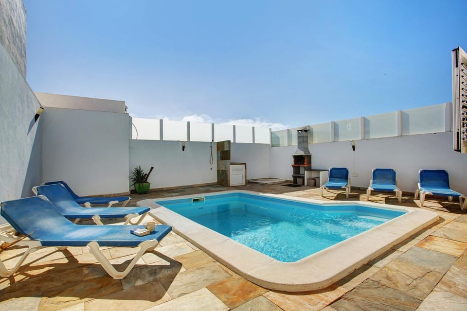 Property building, Living room, Swimming pool
