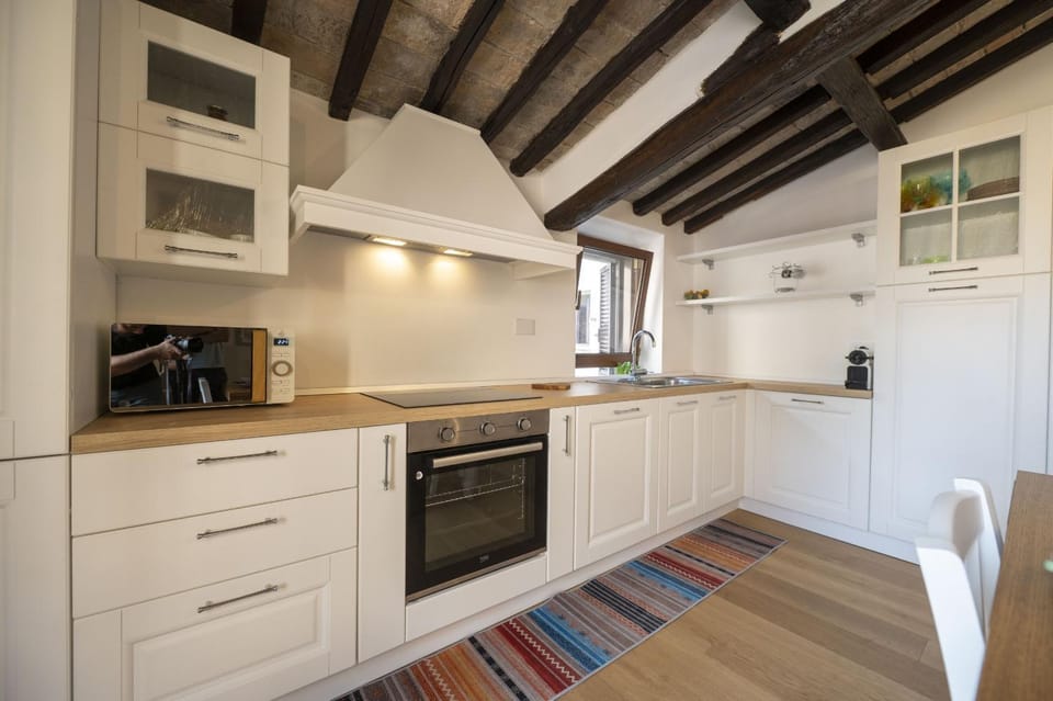 Kitchen or kitchenette, dishwasher, oven, stove