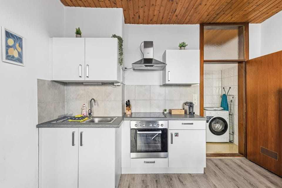 Kitchen or kitchenette, oven, stove, toaster, washing machine, dryer