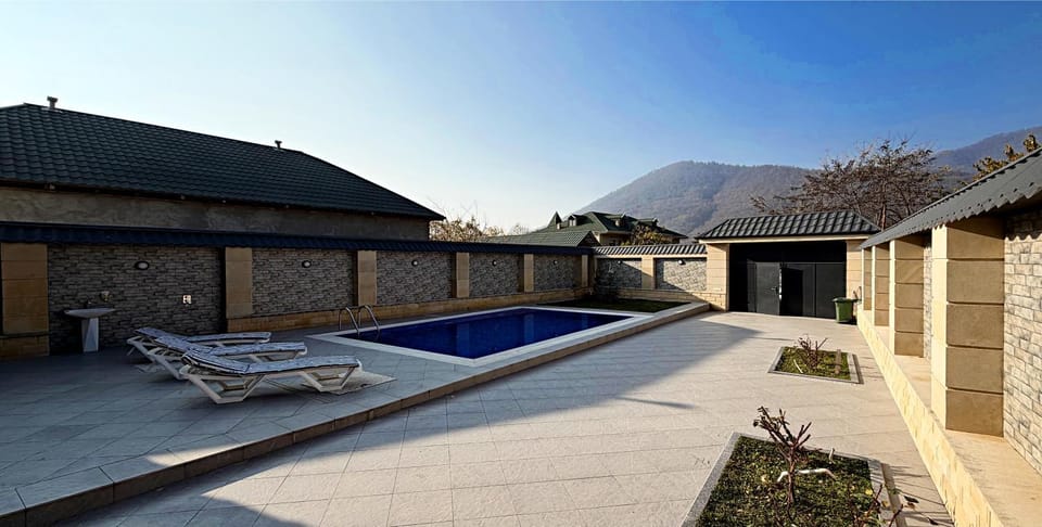 Property building, Patio, Day, Natural landscape, Mountain view, Pool view, Swimming pool, sunbed