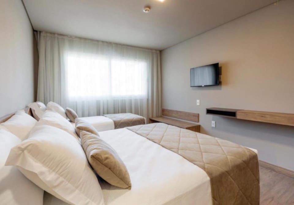 Quarto no Laghetto Golden Resort Apartment in Gramado