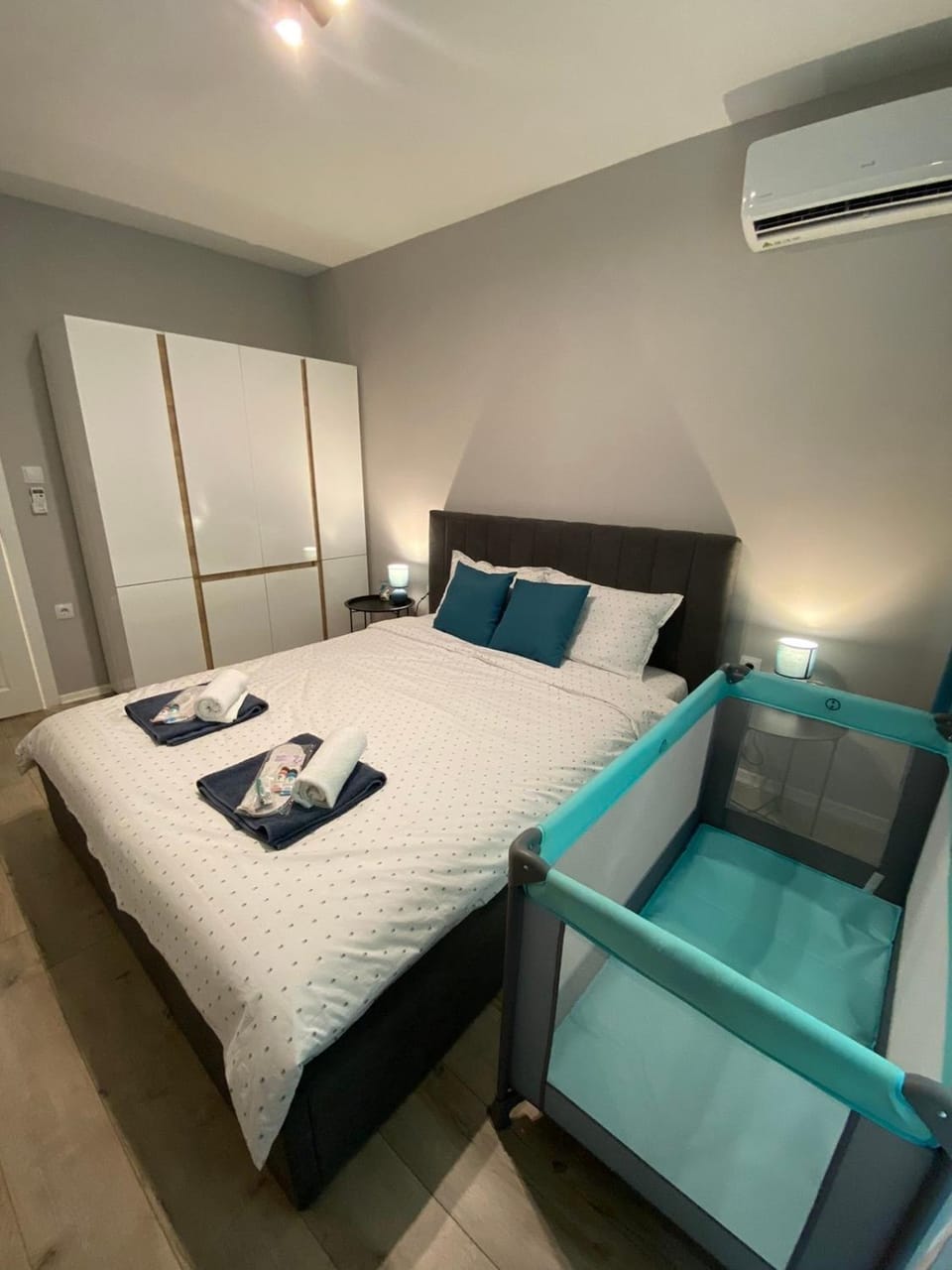 Bed, Seating area, Bedroom, towels, wardrobe, air conditioner