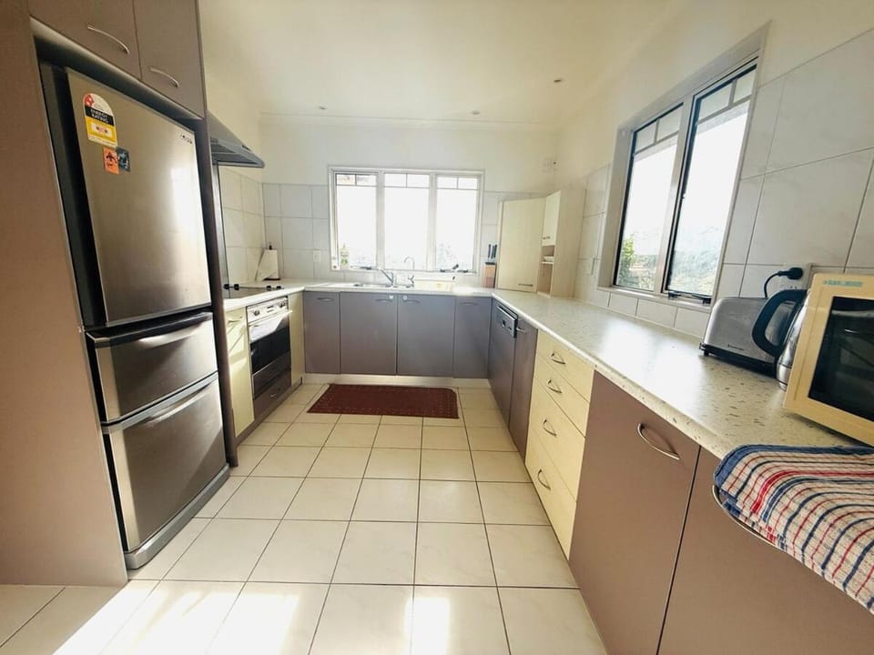 Kitchen or kitchenette, dishwasher, oven, stove