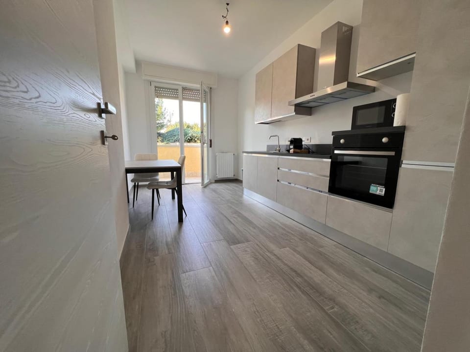 Kitchen or kitchenette, dishwasher, oven, stove