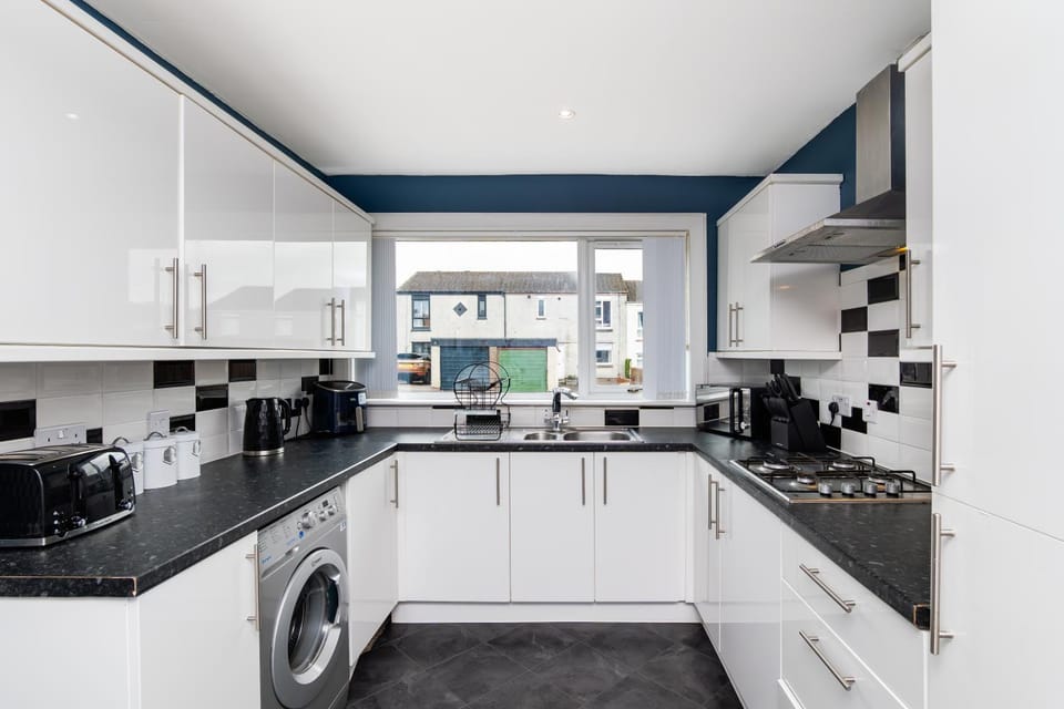 Kitchen or kitchenette, dishwasher, stove, toaster, washing machine