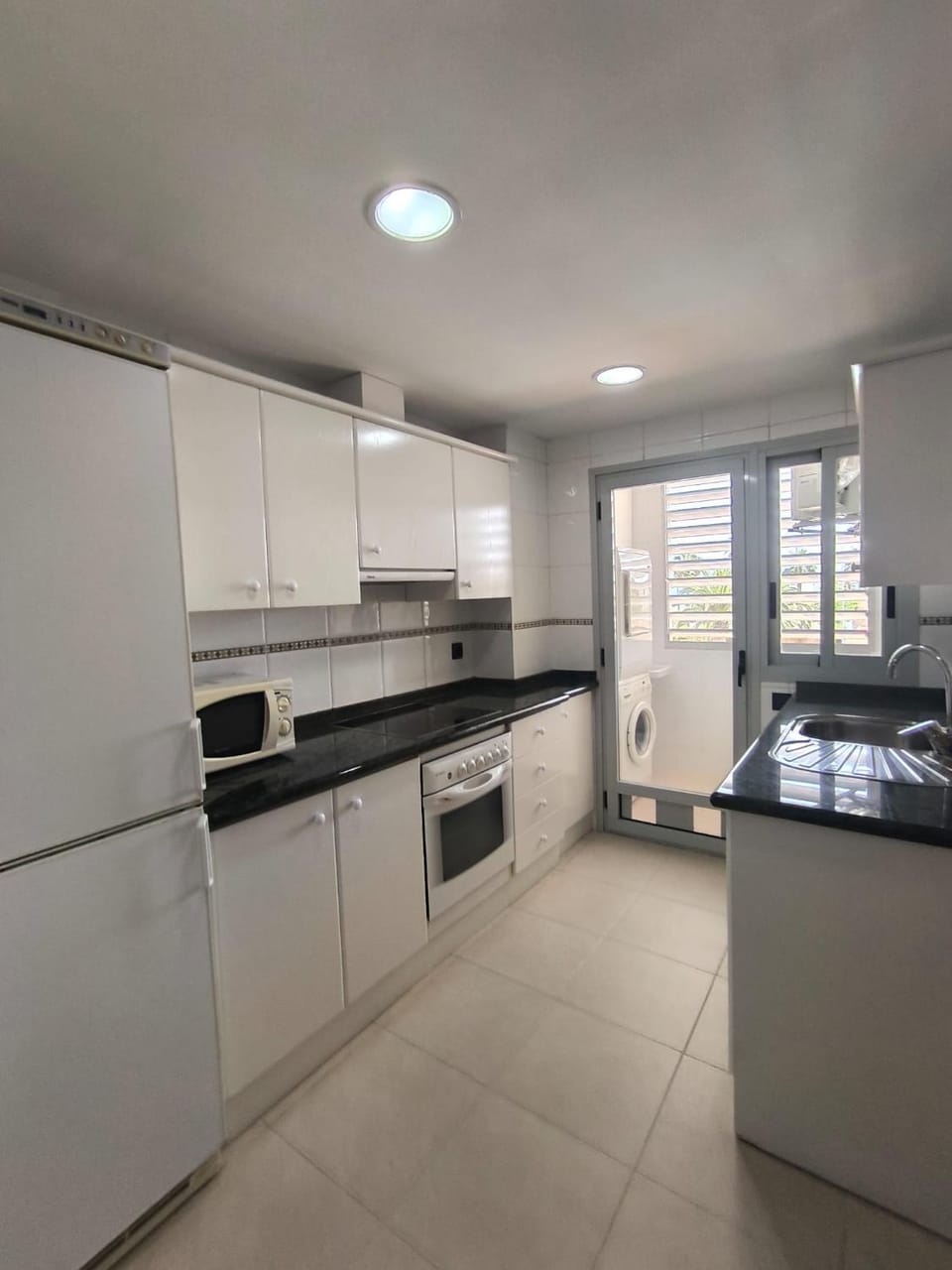 Kitchen or kitchenette, oven, stove