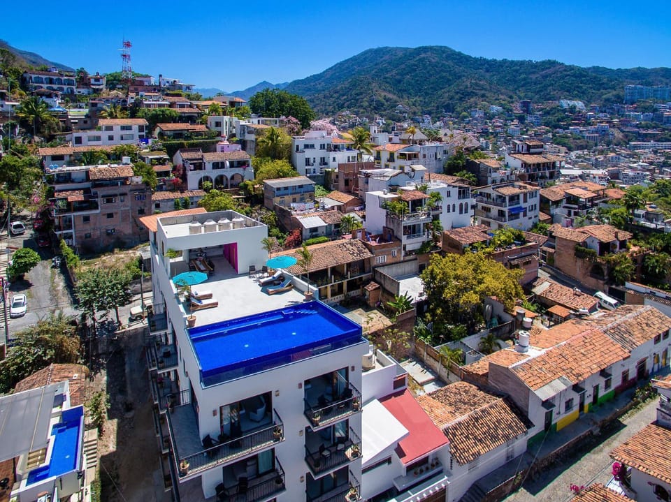 Property building, Day, Neighbourhood, Natural landscape, City view, Mountain view, Street view, Location