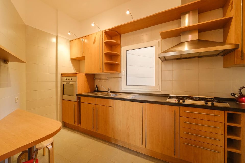 Kitchen or kitchenette, oven, stove, washing machine