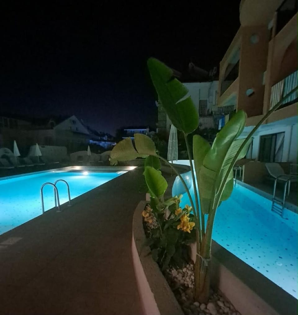 Property building, Night, Pool view, Swimming pool, sunbed