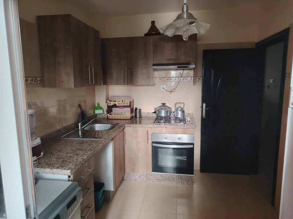 Kitchen or kitchenette, dishwasher, oven, stove