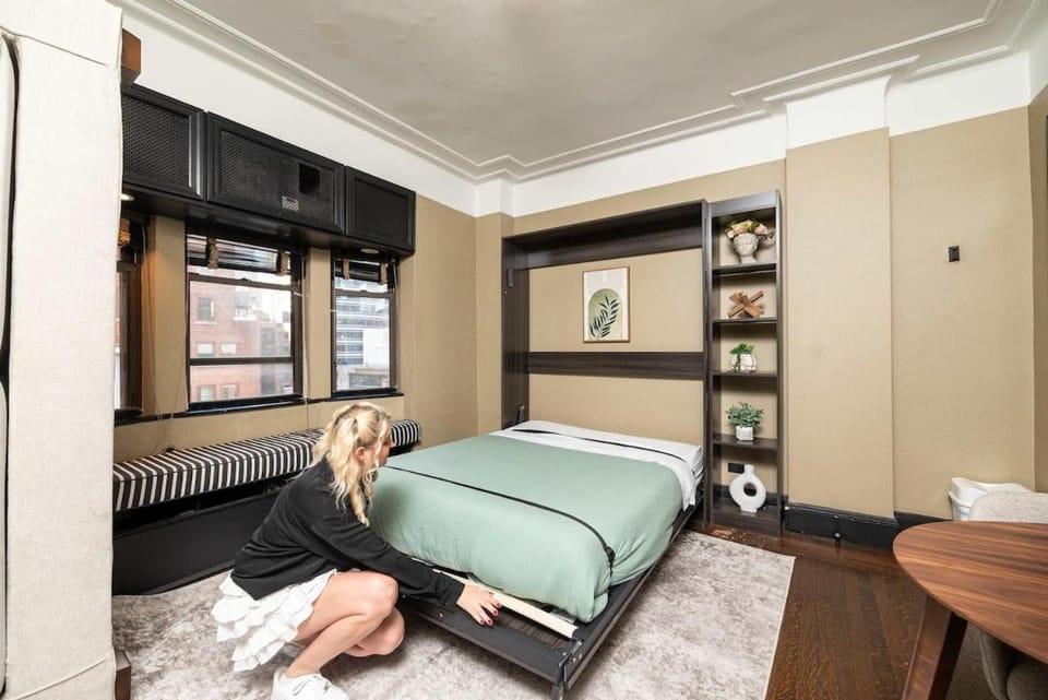 Bed, towels, wardrobe