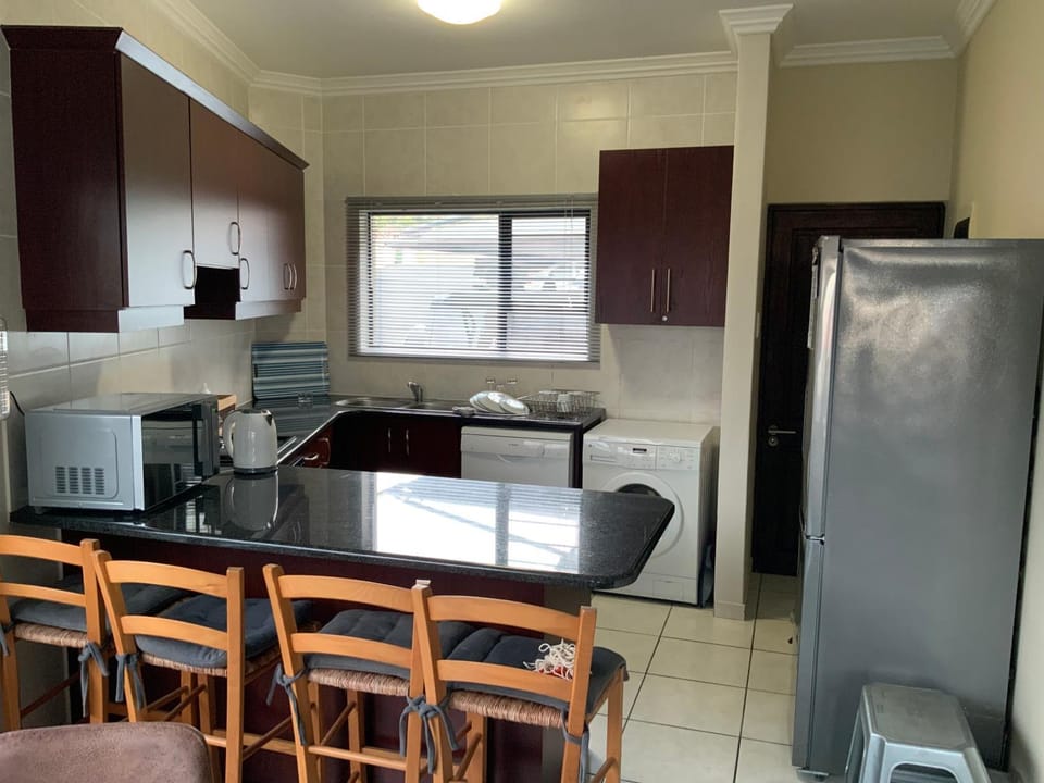 Kitchen or kitchenette, dishwasher, oven, stove, toaster