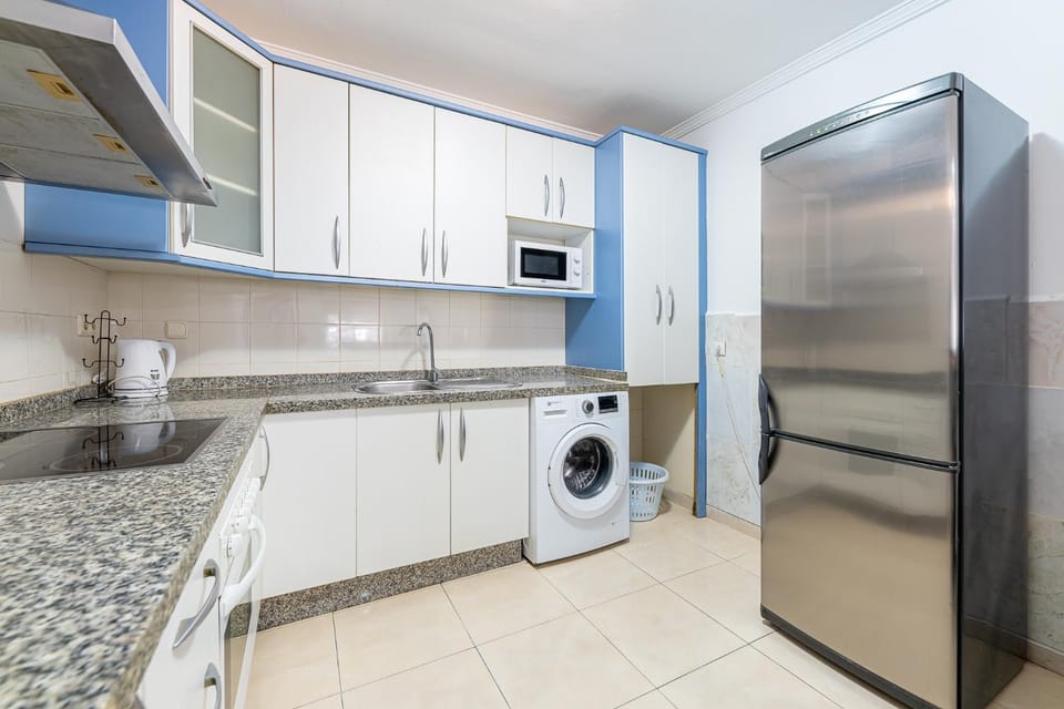 Kitchen or kitchenette, oven, stove, washing machine