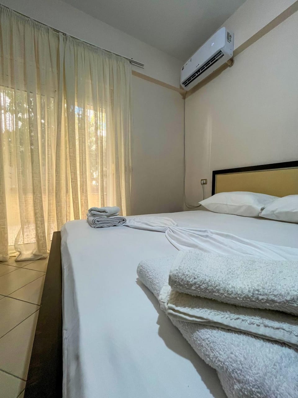 Bed, Photo of the whole room, Bedroom, towels, air conditioner