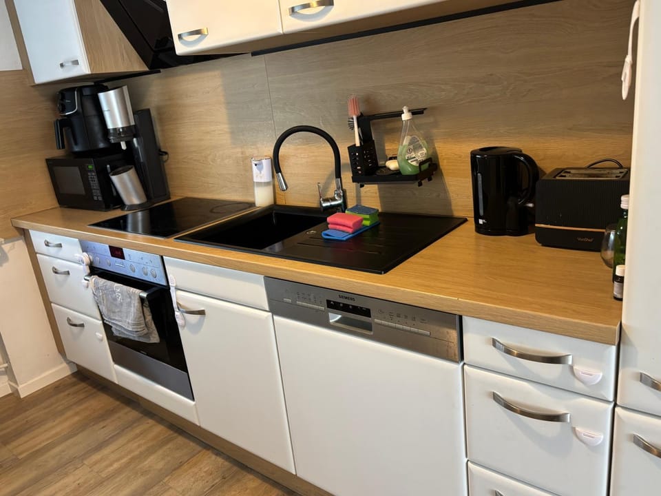 Kitchen or kitchenette, dishwasher, oven, stove, toaster