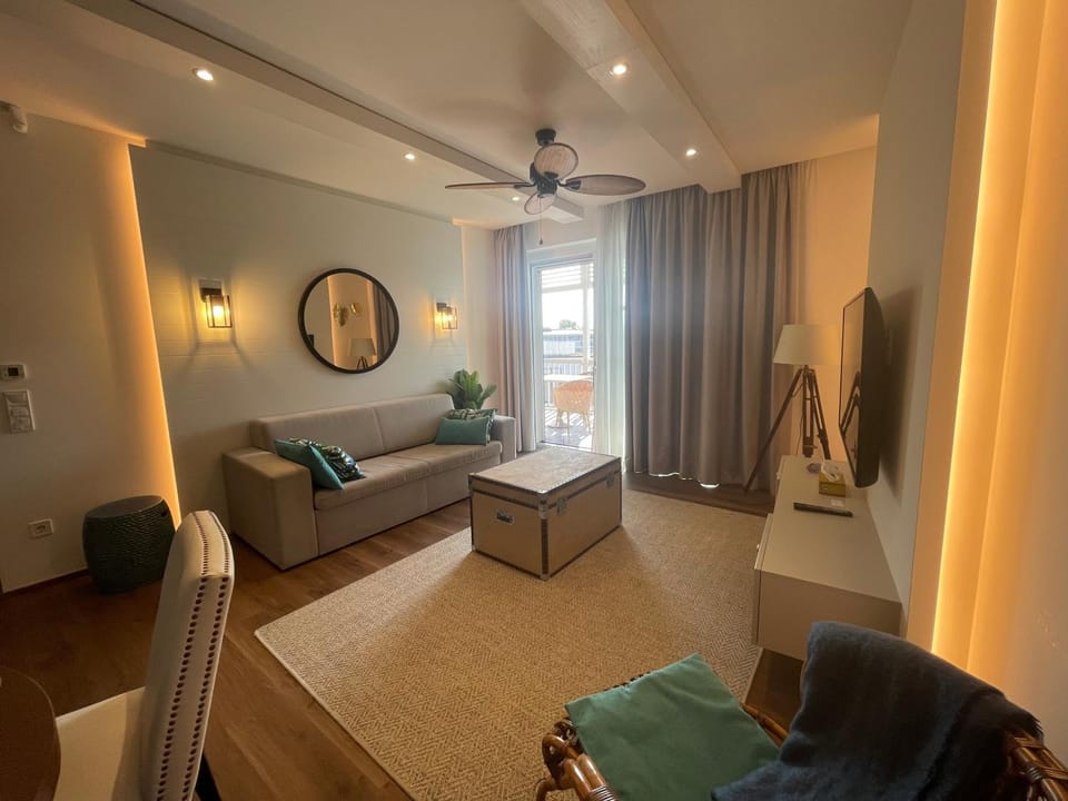 Communal lounge/ TV room, People, View (from property/room), Living room, Photo of the whole room, Family, furniture, air conditioner