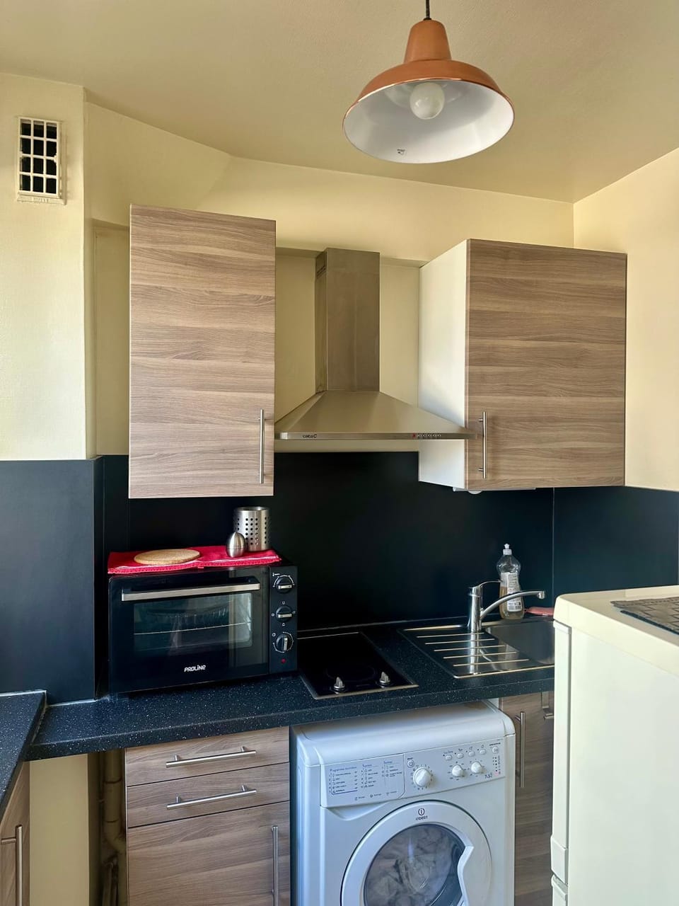 Kitchen or kitchenette, oven, stove, washing machine, dryer