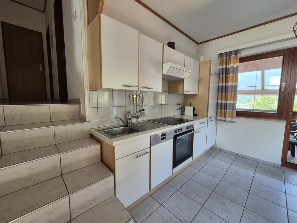 Kitchen or kitchenette, dishwasher, stove, toaster