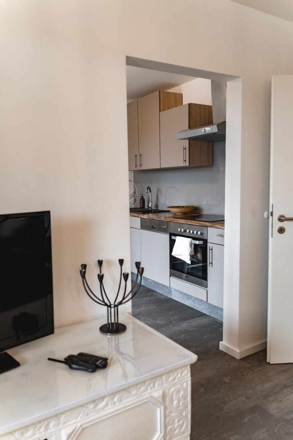 Kitchen or kitchenette, dishwasher, oven, stove