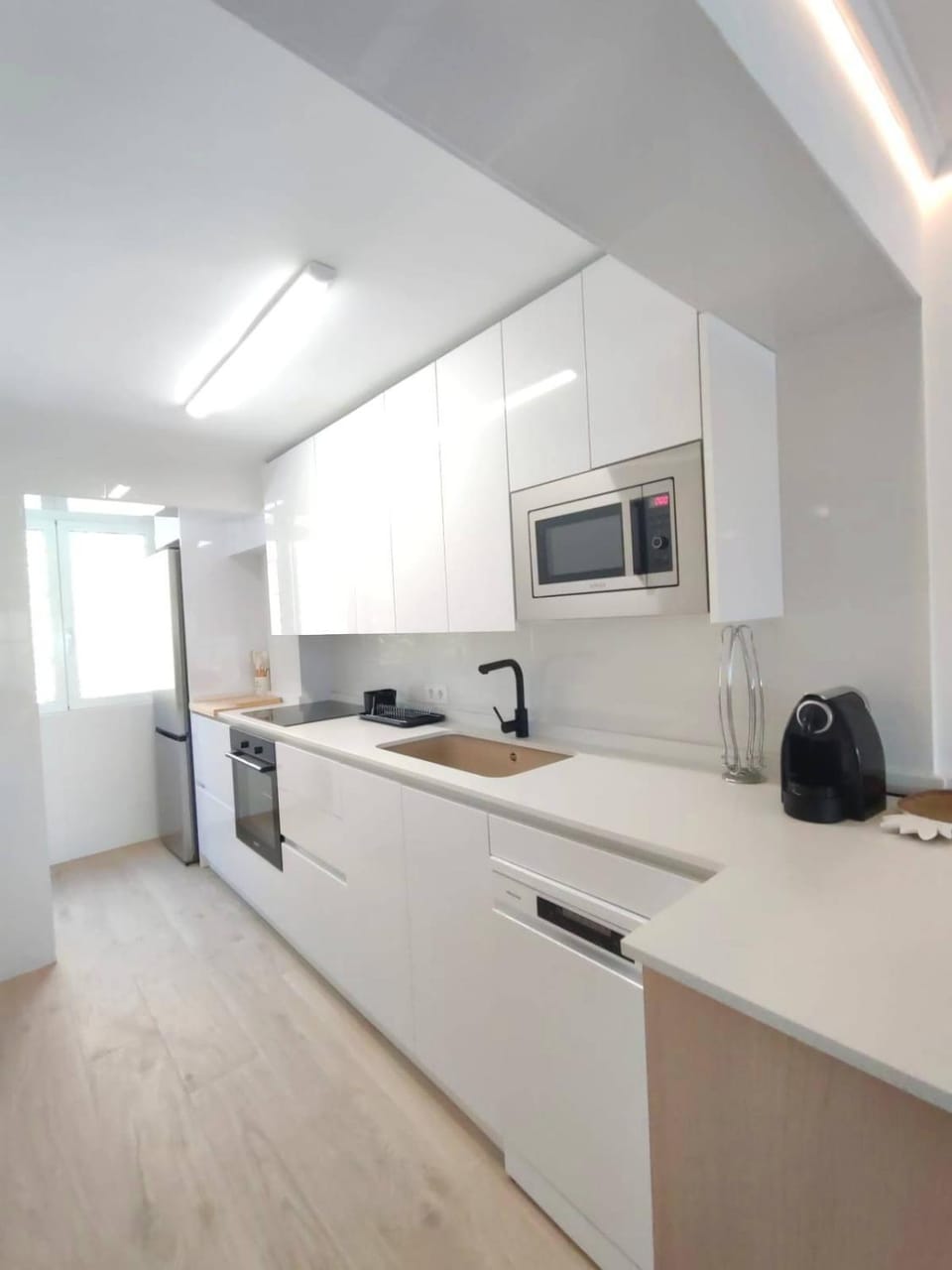 Kitchen or kitchenette, dishwasher, oven, stove, toaster