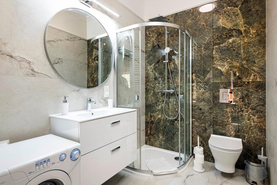 Shower, Toilet, Bathroom, towels, washing machine, dryer