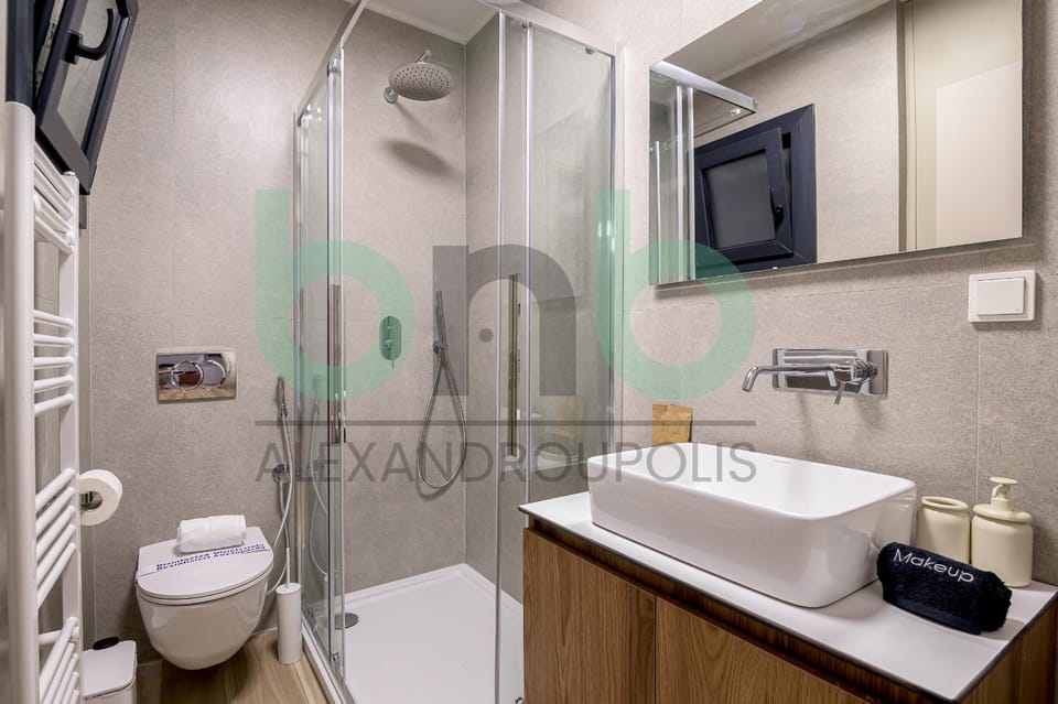 Shower, Toilet, Bathroom, hair dryier, towels