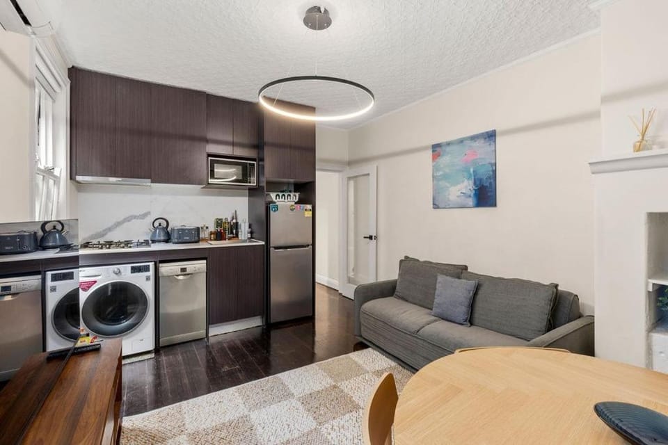 Kitchen or kitchenette, microwave, stove, washing machine