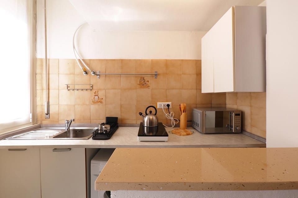 Kitchen or kitchenette, stove