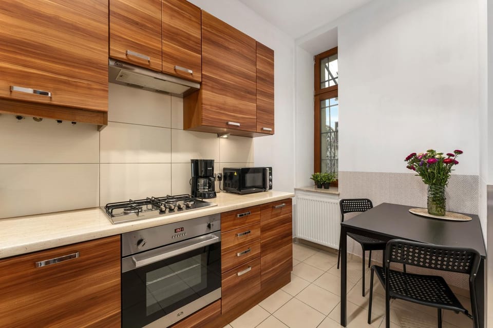 Kitchen or kitchenette, dishwasher, oven, stove