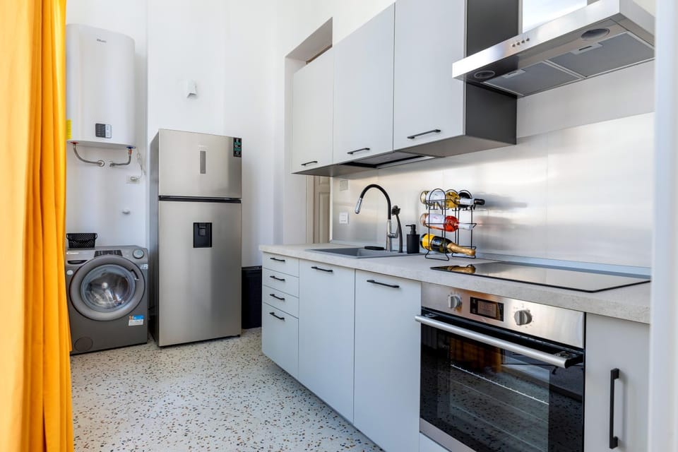 Kitchen or kitchenette, dishwasher, oven, stove, washing machine, dryer