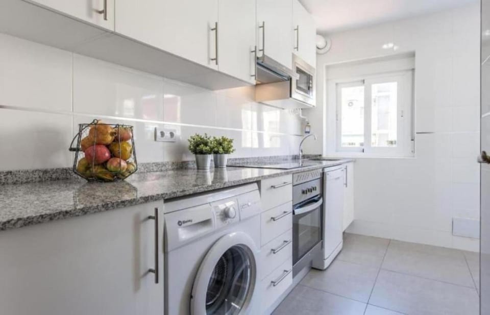 Kitchen or kitchenette, dishwasher, oven, stove, washing machine, dryer