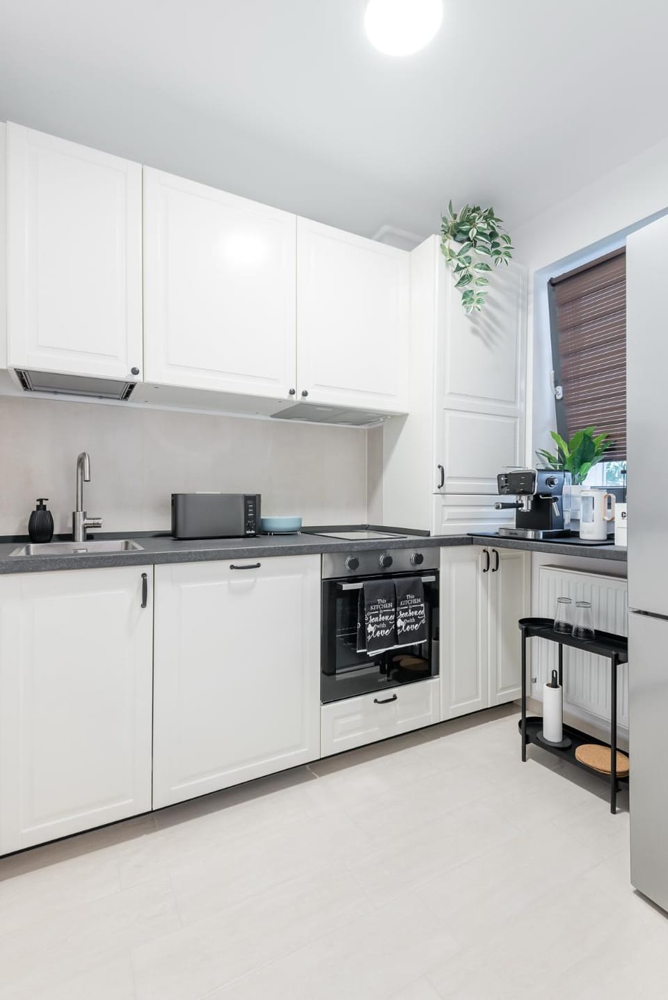Kitchen or kitchenette, dishwasher, oven, stove, toaster