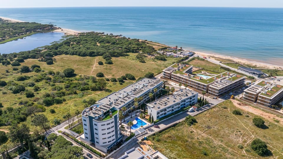 Property building, Nearby landmark, Day, Natural landscape, Bird's eye view, Beach, City view