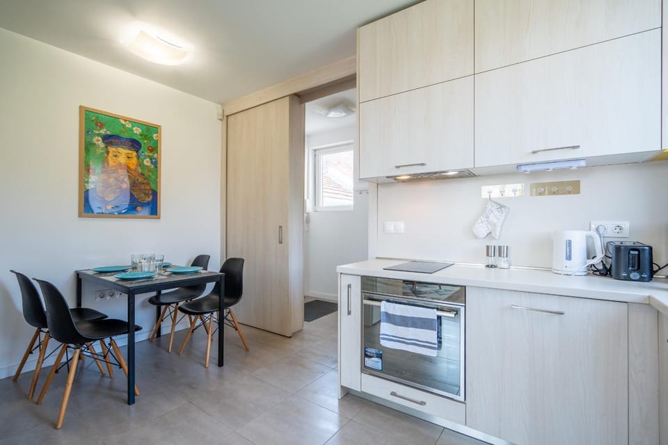 Kitchen or kitchenette, Seating area, Dining area, oven, stove, toaster