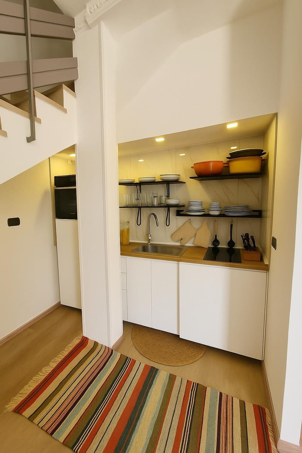 Kitchen or kitchenette, dishwasher, oven, stove