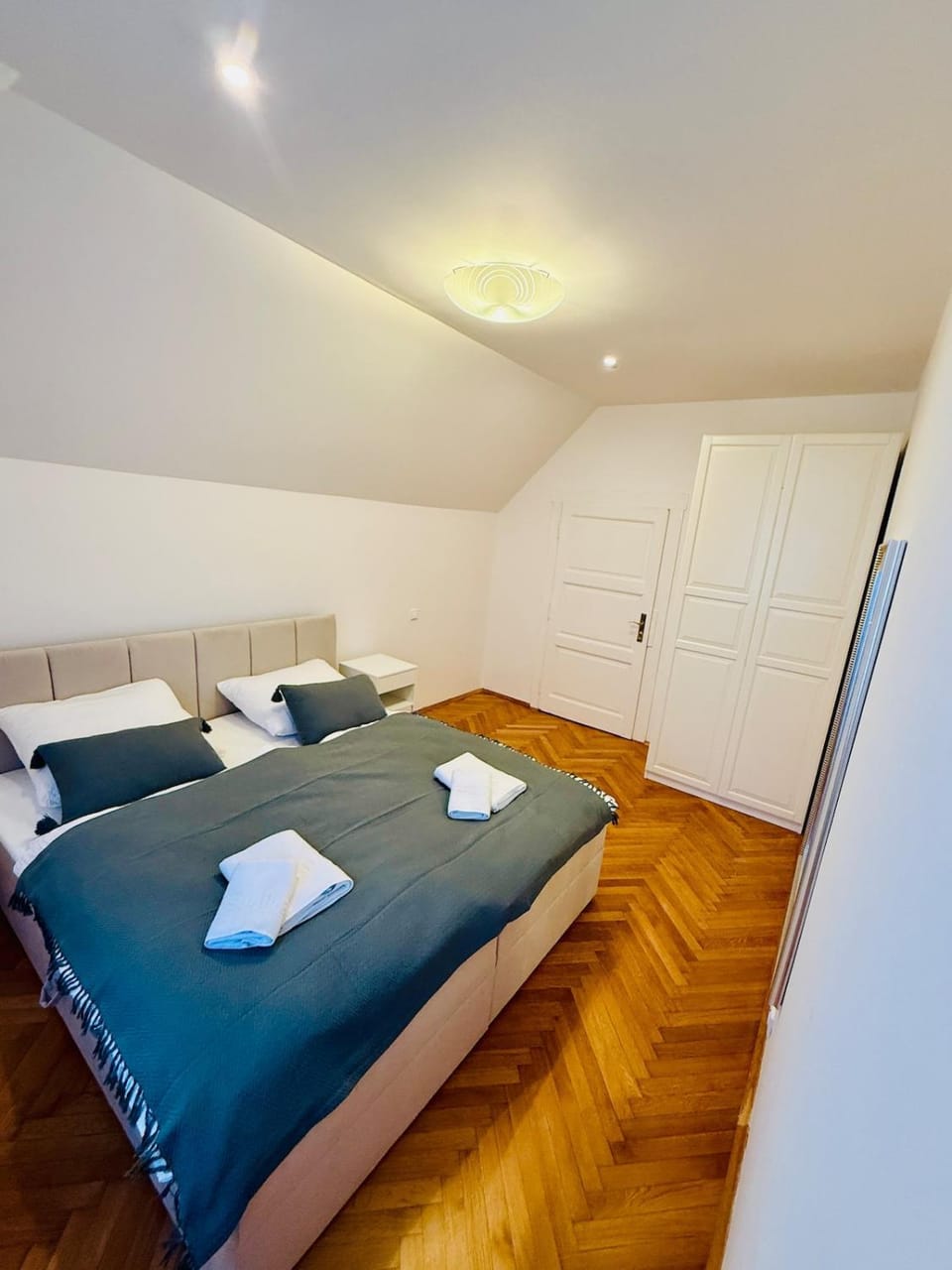 Bed, Photo of the whole room, Bedroom, towels, wardrobe