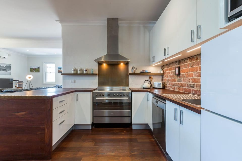 Kitchen or kitchenette, dishwasher, oven, stove