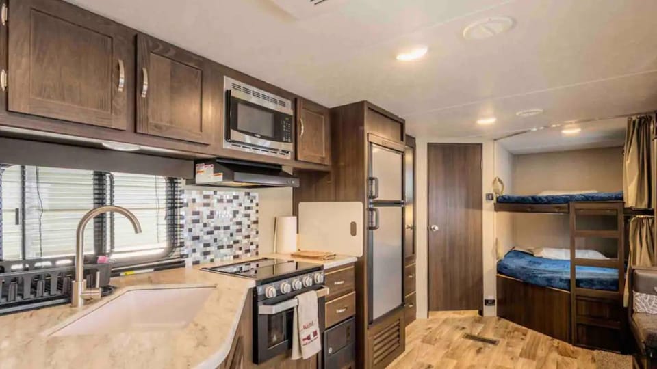 Parked RV Travel Trailer Getaway Wi-Fi with Hookups Campground/ 
RV Resort in Fresno