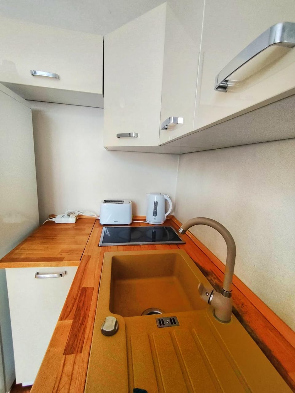 Kitchen or kitchenette, stove, toaster
