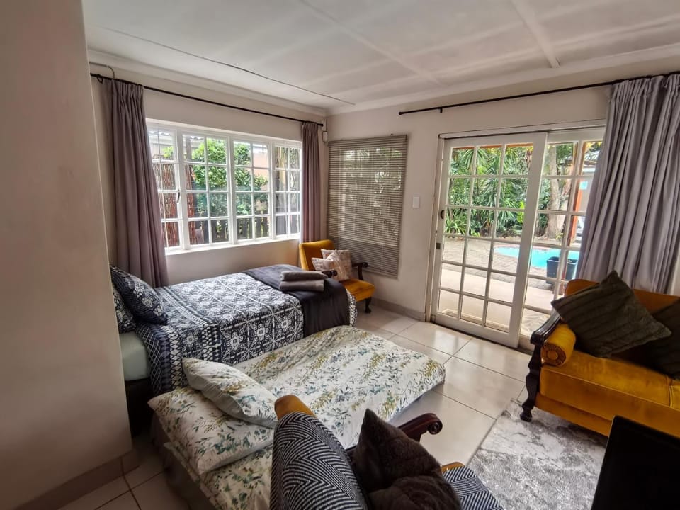 Bed, Living room, Seating area, Pool view